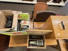 Vintage projector and reels, slide projector and slides.