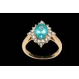Apatite and diamond 14 carat yellow gold ring, the oval cut apatite bordered with 20 diamonds,