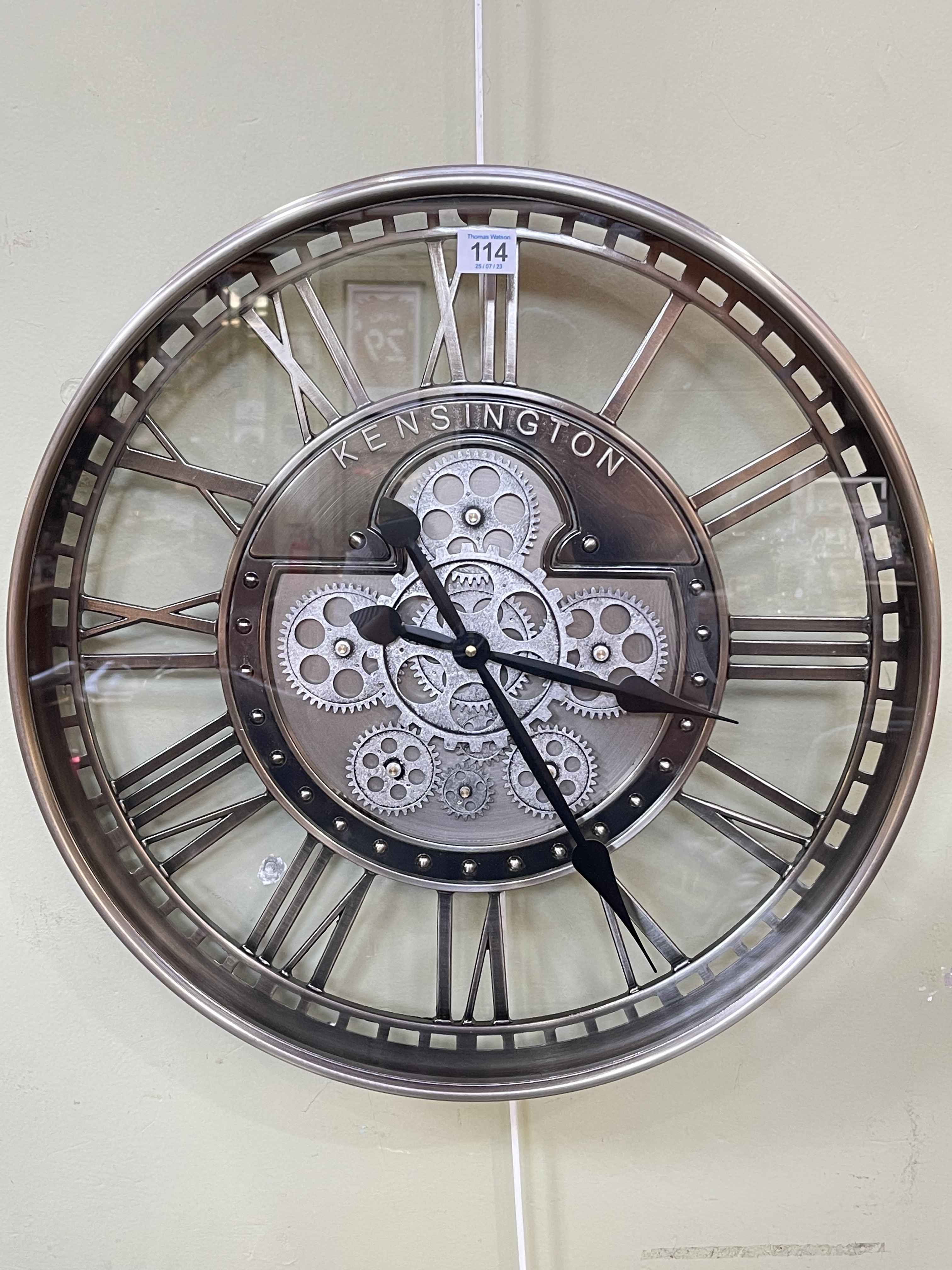 Modern circular Kensington wall clock with visible moving cogs, 52cm diameter.