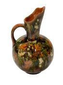 Linthorpe Flowers on brown/green glaze jug, number 1289, 18cm.