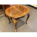 Polished oval shaped coffee table on cabriole legs, 55cm by 67cm by 57cm.