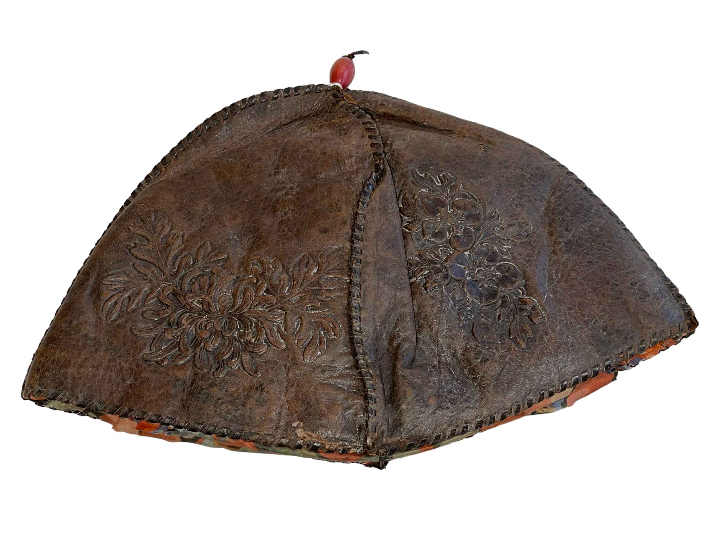 19th Century Chinese leather hat with embossed decoration and red central band.