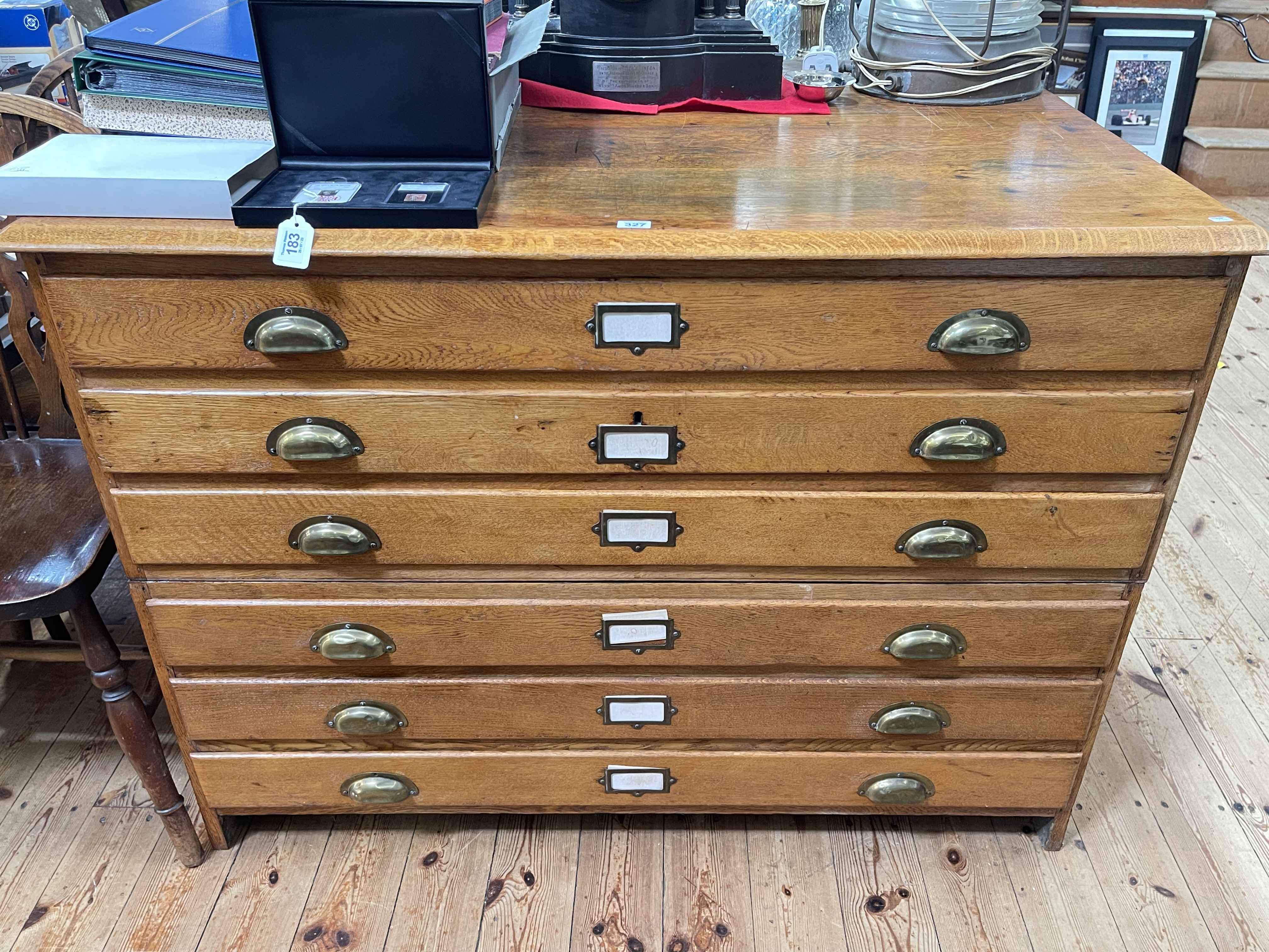 Six drawer oak plan chest, 86.5cm by 120cm by 84cm.