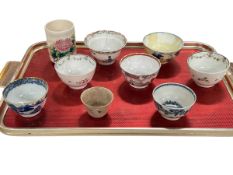 Collection of Chinese tea bowls and small vase.