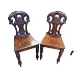 Pair Victorian mahogany shaped back hall chairs.