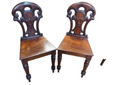 Pair Victorian mahogany shaped back hall chairs.