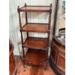 Victorian mahogany four tier etagé with turned pillars and base drawer, 119cm by 46cm by 35.5cm.