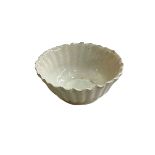 Small Chinese scalloped edge white glazed bowl, 6.5cm diameter.