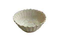 Small Chinese scalloped edge white glazed bowl, 6.5cm diameter.