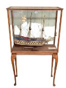 Large model of a 17th Century masted ship 'Wasa' in oak glazed case on Queen Anne legs.