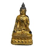 Chinese gilt bronze model of a Buddha, 28cm.