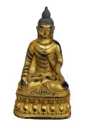 Chinese gilt bronze model of a Buddha, 28cm.