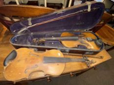 Two vintage violins, three bows and one case.