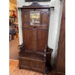 1920's carved oak hallstand with box seat, 165cm by 120cm by 37cm. (Evidence of Woodworm).