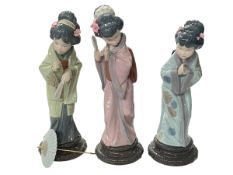 Three Lladro Japanese lady figures, with boxes.