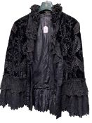 Black velvet embroidered ladies evening jacket.