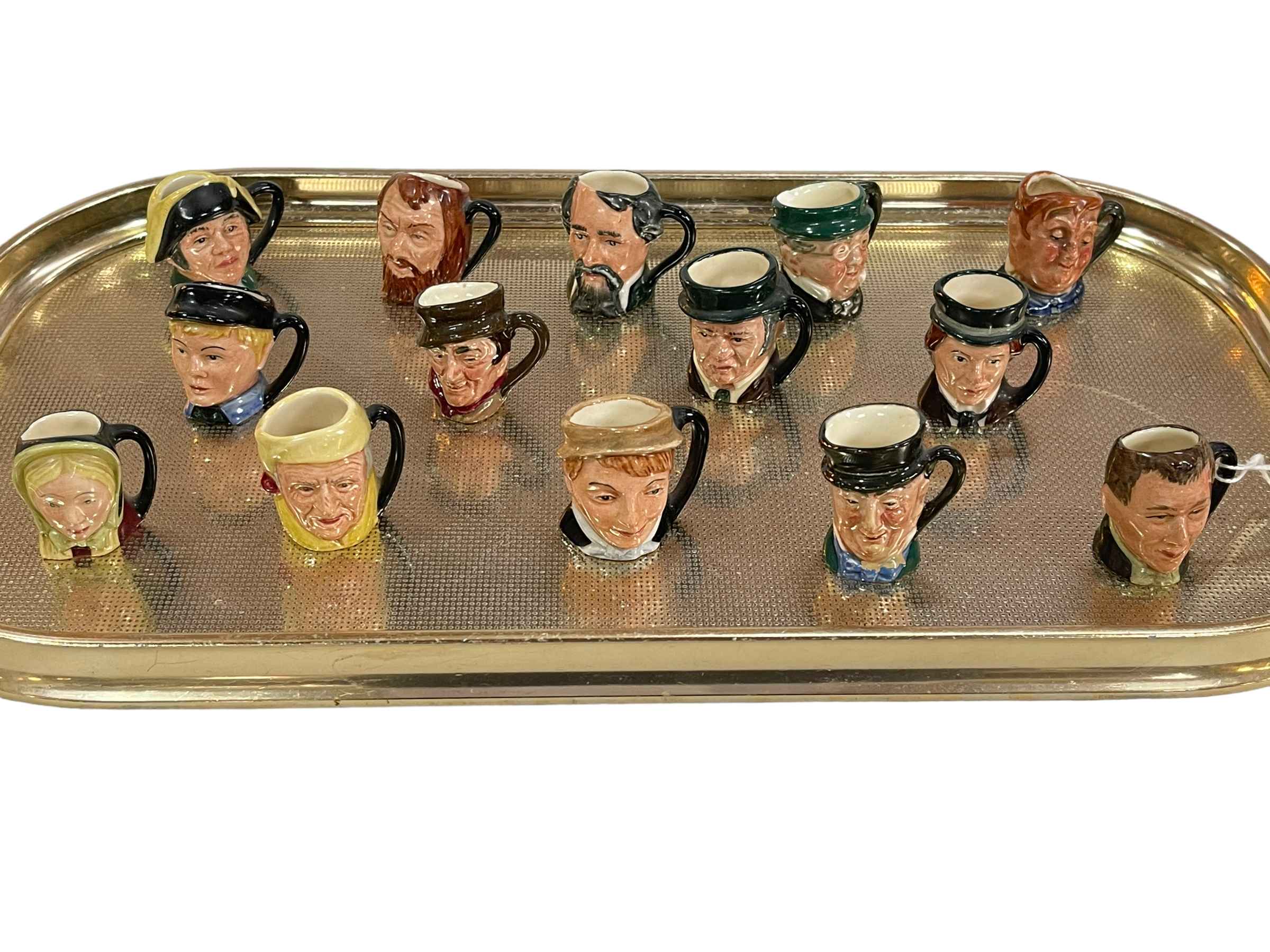 Collection of fourteen miniature Royal Doulton character jugs.