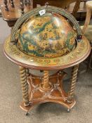 Terrestrial globe and astrological cocktail cabinet.