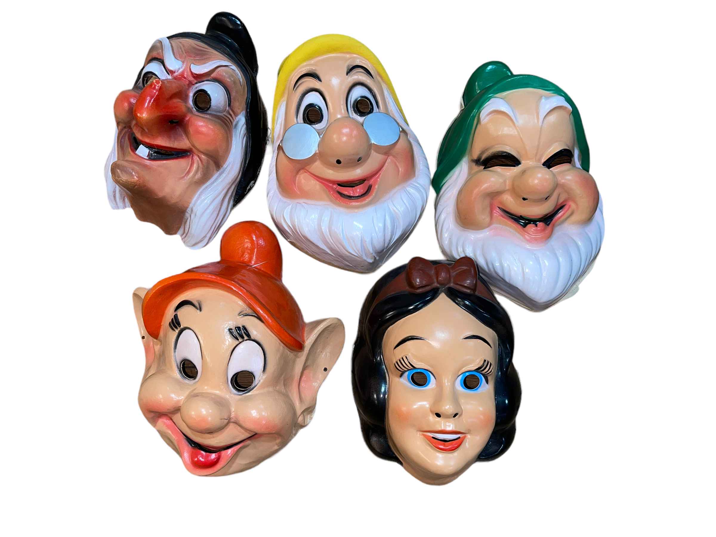 Circa 1970 Disney masks including Snow White, Happy, Dozy, etc.