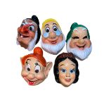 Circa 1970 Disney masks including Snow White, Happy, Dozy, etc.