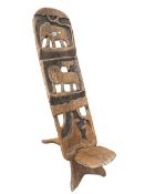 African carved animal decorated birthing chair.