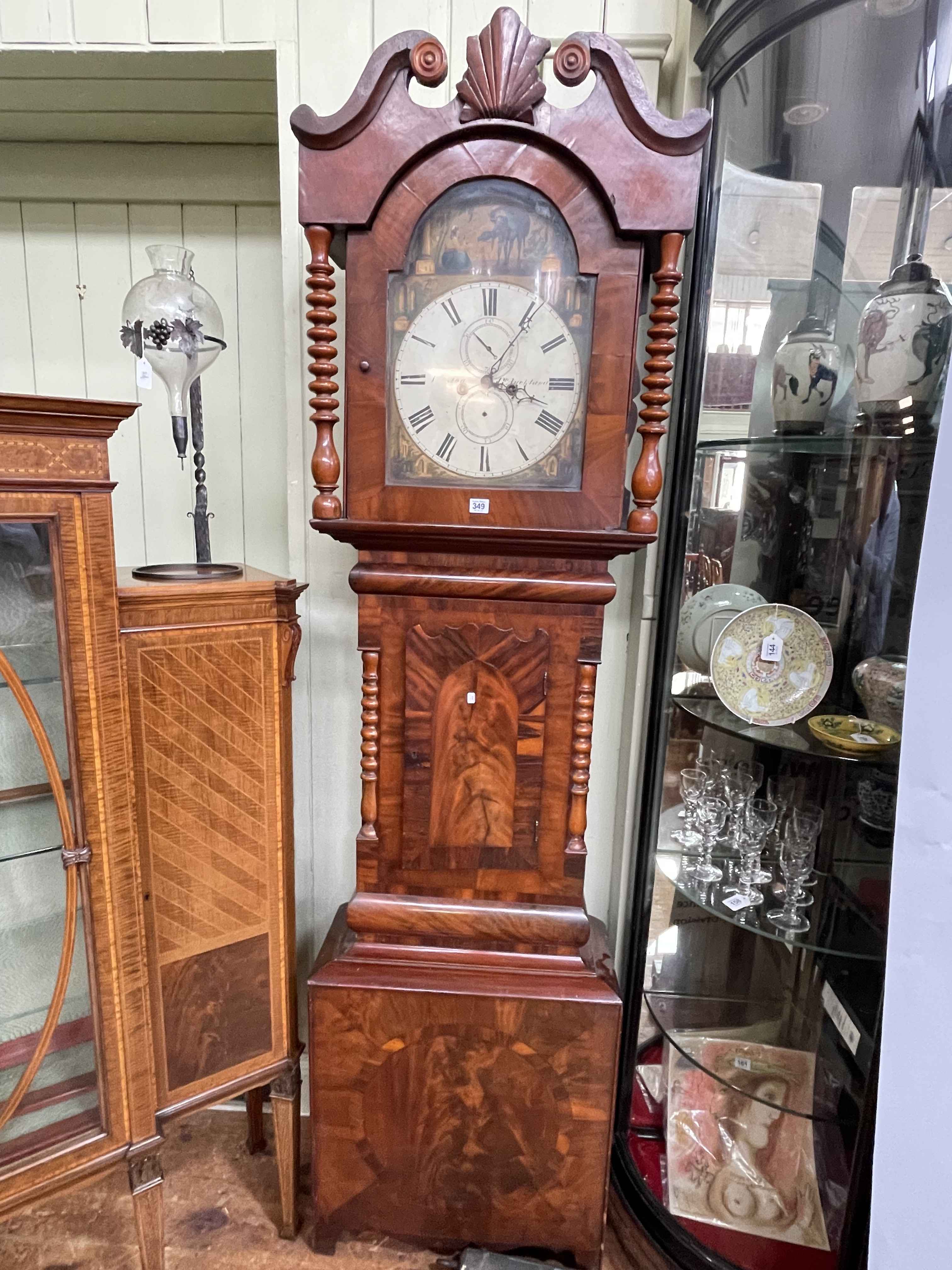 Antique mahogany cased eight day longcase clock having painted arched dial, 225cm.
