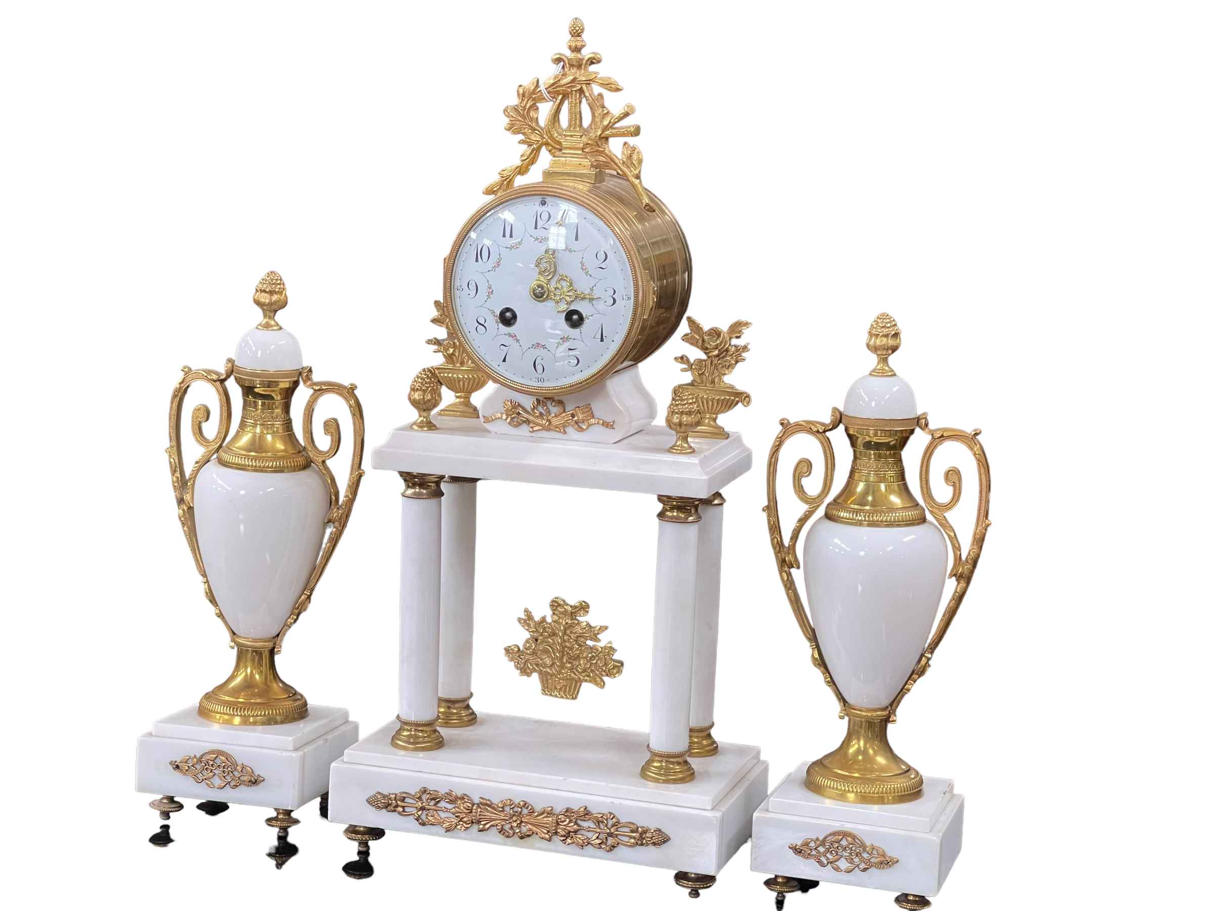Ornate marble and gilt metal three piece clock garniture.