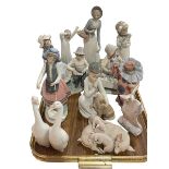 Four Lladro groups and advert, and six Nao and other figures (11).