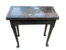 Antique carved mahogany fold top tea table having frieze drawer and on pad feet,