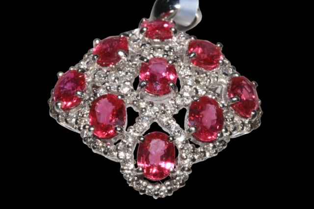Ruby and diamond cluster pendant set in 18 carat white gold, rubies approx 3.