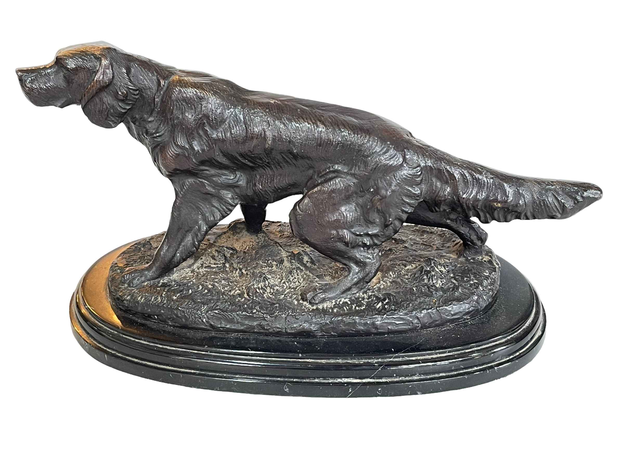 Ornate bronze retriever dog on marble base.