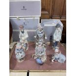 Six Lladro clown figures with five boxes.