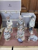 Six Lladro clown figures with five boxes.