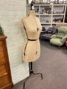 Vintage eight section dress makers dummy on triform stand.