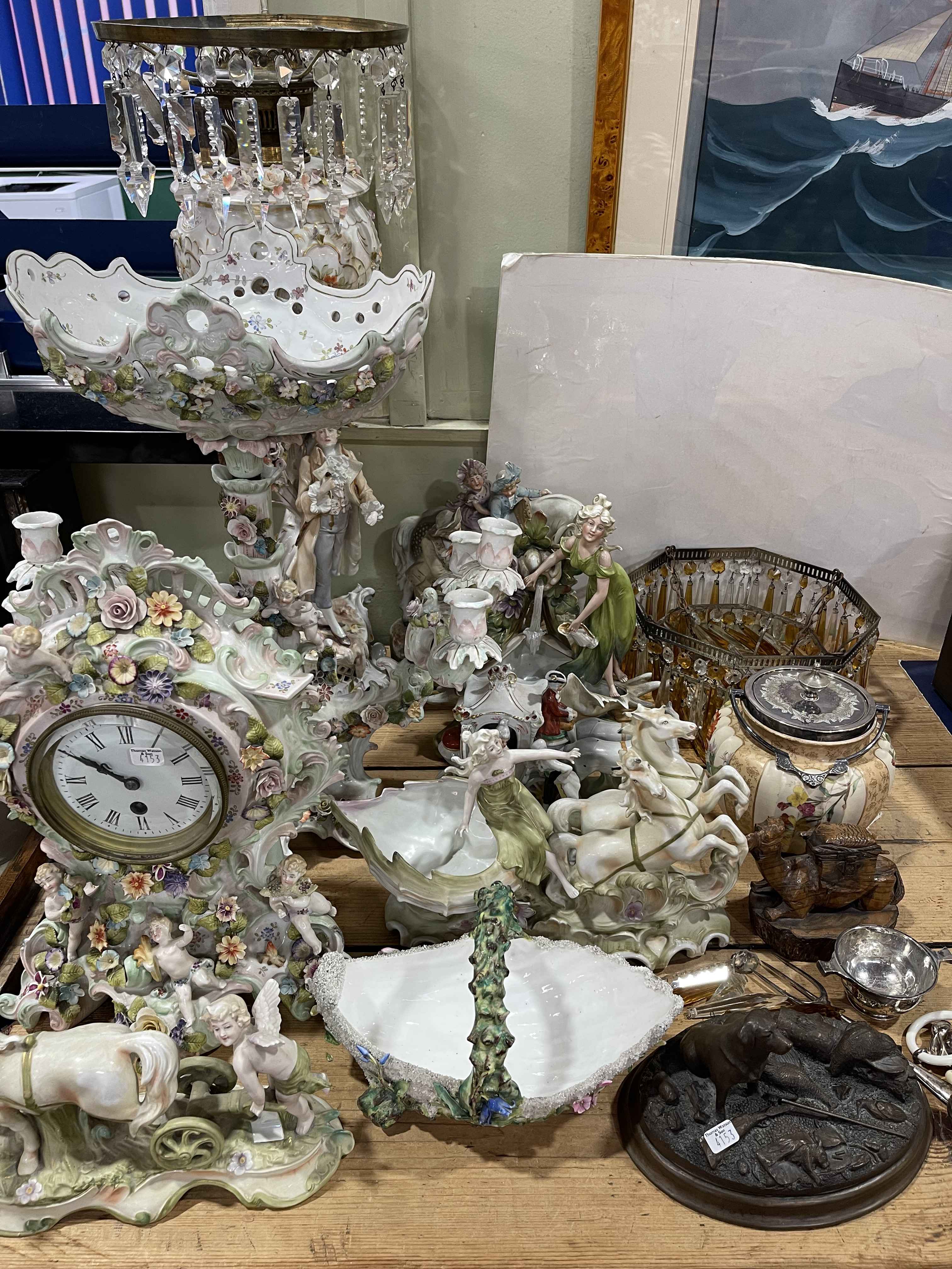 Collection of Continental Cupid and figural porcelain including oil lamp and clock,