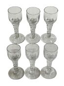 Set of six facet stem Georgian wine glasses.