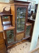 Art Nouveau inlaid mahogany cabinet having central leaded glazed door above an inlaid cupboard door