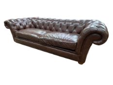 Brown deep buttoned and studded leather three seater Chesterfield settee, 240cm.