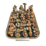 Collection of twenty six Hummel figures.