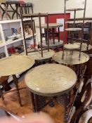 Collection of ten brass topped folding tables, low elephant table, ethnic stool,