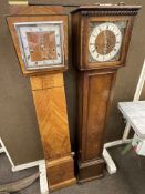 Two walnut and oak early 20th Century grandmother clocks.
