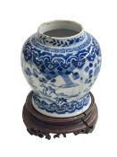 Chinese porcelain blue and white vase on wood stand decorated with horses and riders in landscape,