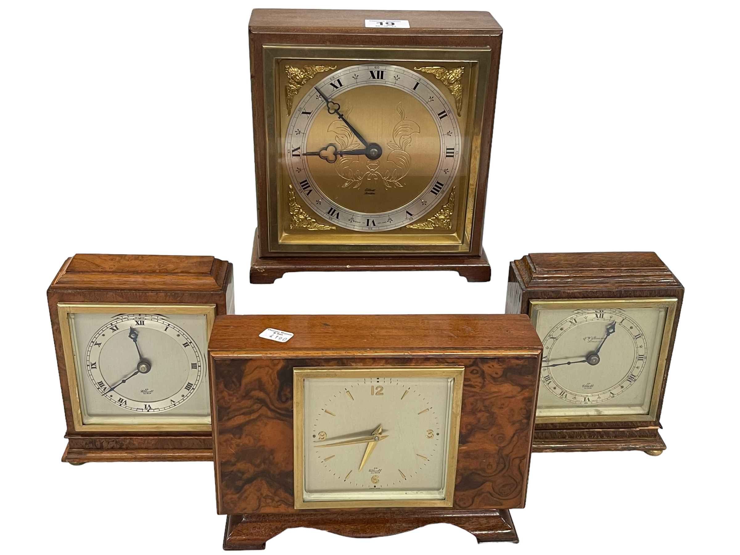 Four Elliott mantel clocks.