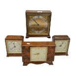 Four Elliott mantel clocks.