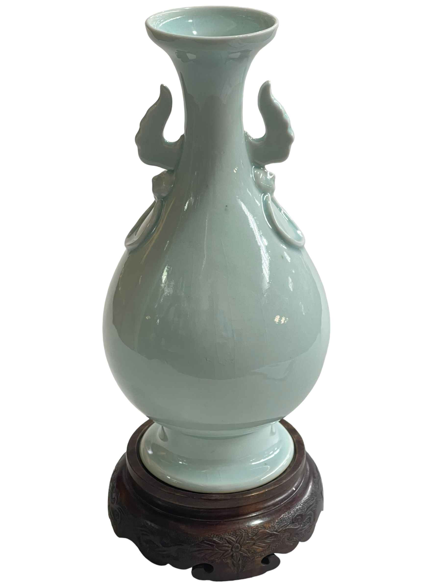 Chinese pale blue porcelain vase with twin handles of bulbous form with flared rim on wood stand, - Image 2 of 3