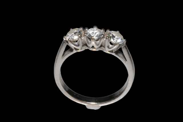 Diamond three stone 18 carat white gold ring, total diamond weight approx 1 carat, size O.