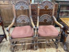 Pair carved oak elbow chairs.