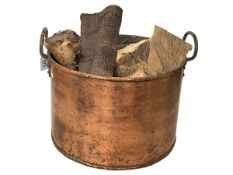 Ornate two handled copper log bucket, 32cm high.