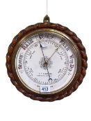 Circular oak rope twist aneroid barometer having enamelled dial, GF Clarkson, Northallerton.