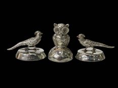 Pair of silver 'pheasant' place name holders, London 1928, and owl holder, Birmingham 1907 (3).